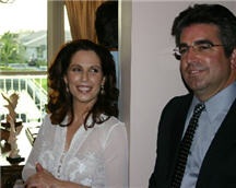 Diana and Dr. John Ortiz ( the firm's General Contractor) socialize with other guests while proudly displaying the office